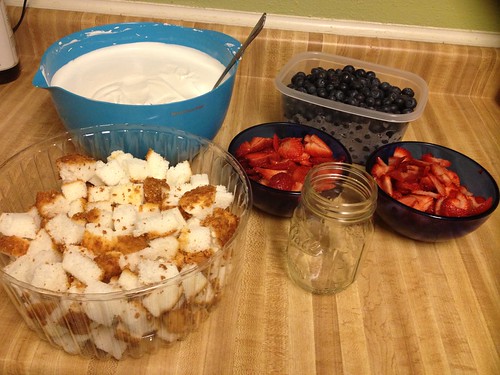 Strawberries, blueberries, angel cake, pudding and mason jar
