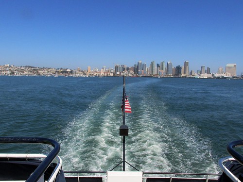 An aft view of the San Diego city skyline aboard a harbor sightseeing cruise.  San Diego california.  June 2013. by Eddie from Chicago