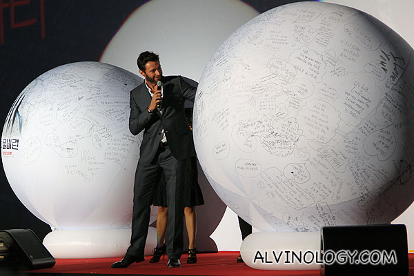 Hugh Jackman picking questions to answer from two giant balls 