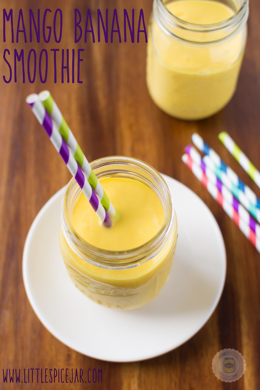 Mango Banana Smoothie in mason jar on white plate with text