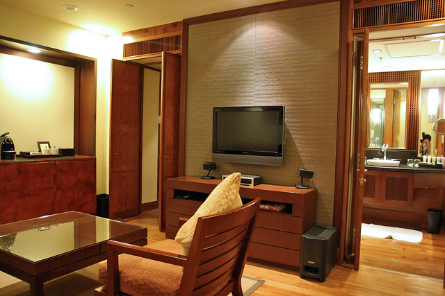32-inch LCD TV and living area, plus bathroom entrance