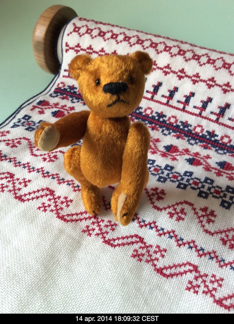 Miniature bear and cross-stitch