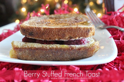Berry Stuffed French Toast on white plate with fork.
