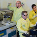 From left, Los Alamos scientists Roy Copping, Sean Reilly, and Daniel Rios.  Copping examines the Buchi Multivapor P-12 Evaporator, and Reilly and Rios are at the Agilent Technologies Cary 60 UV-Vis Spectrometer.