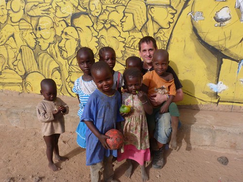With children in one of the villages of houses painted in Gambia