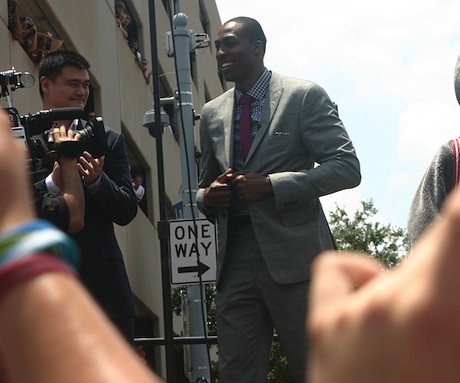 July 13, 2013 - Yao stands behind Dwight Howard outside Toyota Center at his welcome rally