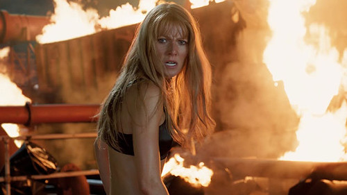 Pepper Potts, in a bra surrounded by fire