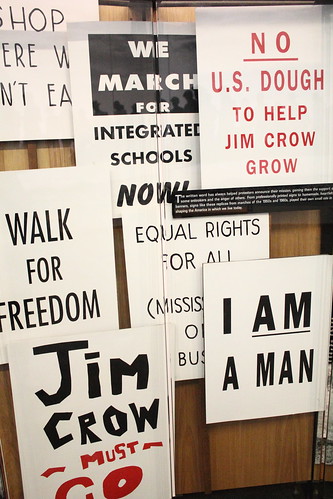 Signs aginst Jim Crow laws
