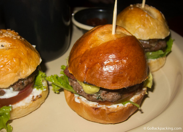 Three mini-burgers, each with a different topping