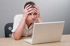 Desperate woman with laptop