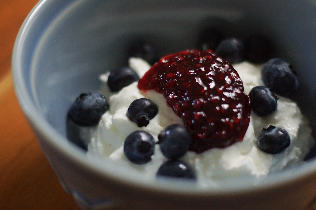 Greek yogurt, raspberry jam and blueberries