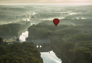 balloon over french chateau.