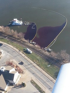 An overflight photo taken of the Stephen L. Colby, a towboat which struck a submerged object causing it to partially sink near LeClaire, Iowa. The Coast Guard, Illinois EPA, Iowa DNR and local emergency crews continue to respond to oil discharge into the Mississippi River, Nov. 27, 2013. (Photo courtesy of U.S. Department of Fish and Wildlife Services)