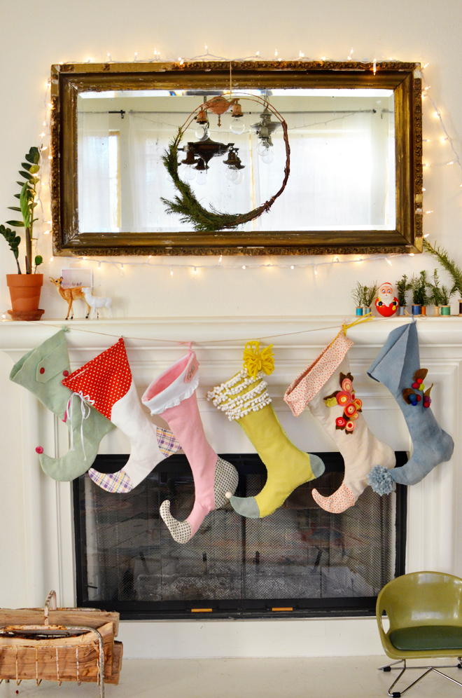 colorful DIY elf Christmas stockings on mantel