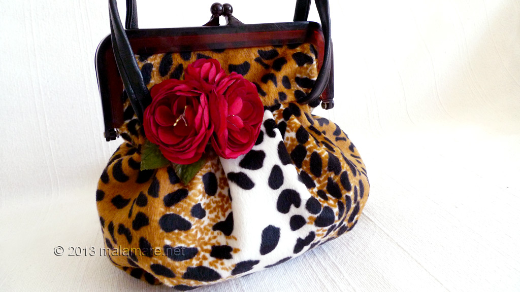 velvet handbag with leopard pattern