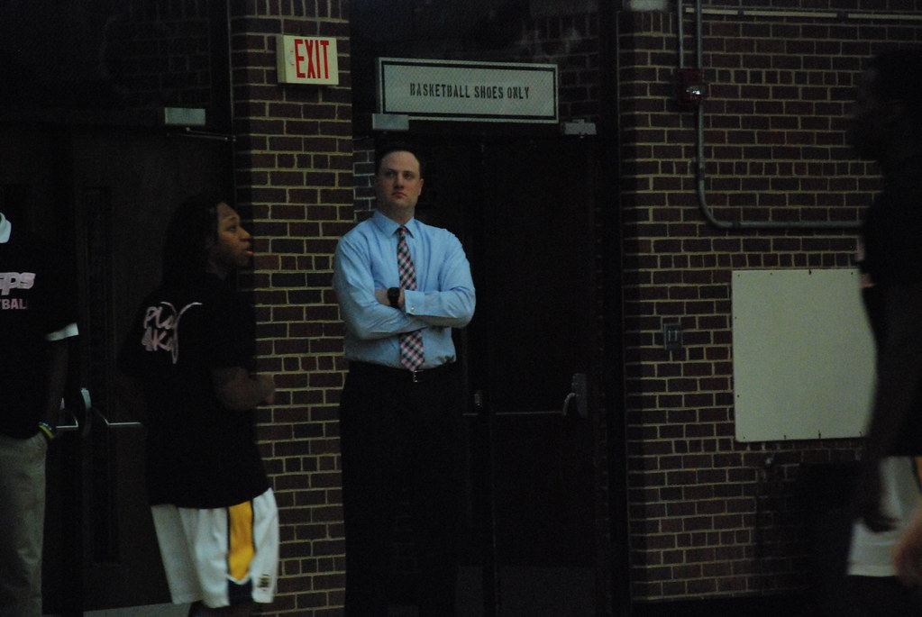 E&H head coach David Willson watches his team's warmups.