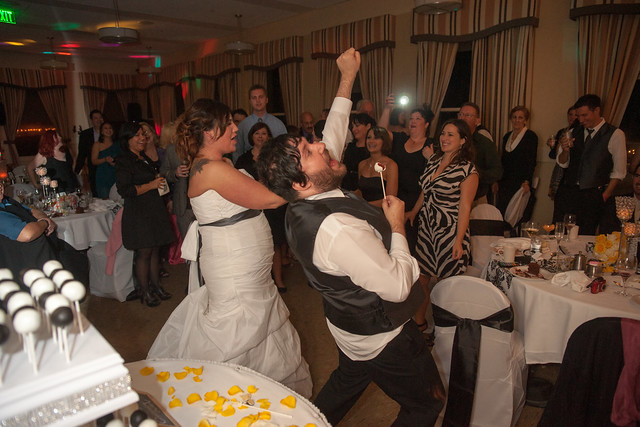 The bride and groom rocking out with their cake pops!