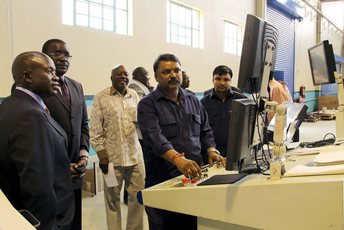 Secretary for Information and Publicity Mr George Charamba (second from left) being shown how the Zimpapers’ new US$2,2 million Orient X-Cel printing press works at Natprint on September 3, 2013. by Pan-African News Wire File Photos