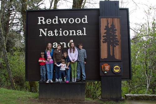 Cousins in front of Redwood National Park Sign