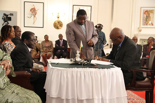 Minister of Finance Patrick Chinamasa being sworn in to a new cabinet post for the Republic of Zimbabwe. The ceremony took place on September 11, 2013. by Pan-African News Wire File Photos