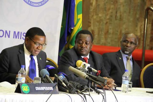 Leaders of the Southern African Development Community (SADC) Observer Mission Bernard Mwembe addresses the media with Dr Tomaz Solamao at far right. SADC endorsed the Zimbabwe elections of  July 31, 2013. by Pan-African News Wire File Photos