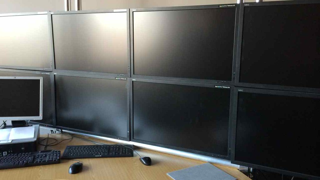 Photo of bank of 8 screens