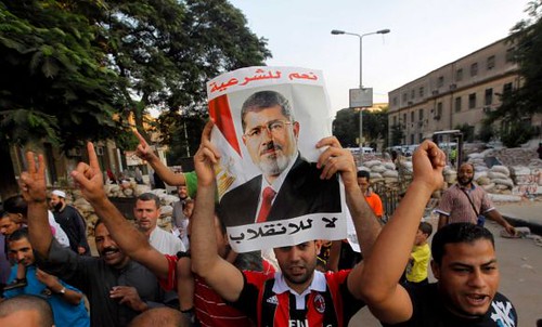 Egyptian pro-Morsi demonstration on Aug. 10, 2013. The military-backed regime has ordered the protesters off the streets within twenty-four hours. by Pan-African News Wire File Photos
