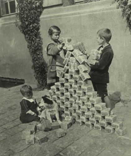 Children playing with German inflation money