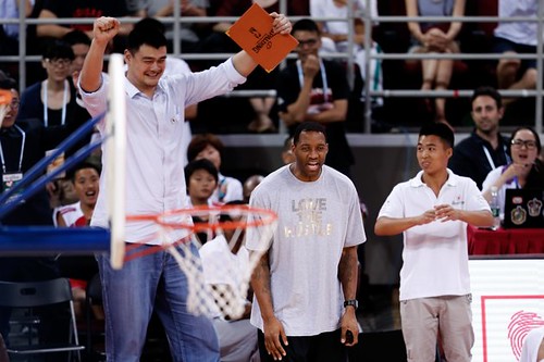 July 1st, 2013 - Yao Ming and Tracy McGrady cheer on their team of young players in the 3rd quarter of the Yao Foundation charity game