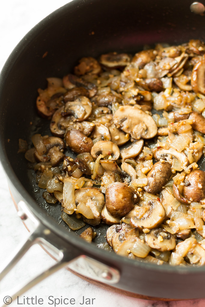 sautéed onion and mushroom mixture in saute pan