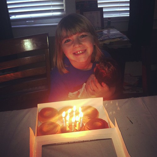 Blowing out the donut candles.