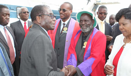 President Mugabe is welcomed by Chief Chiduku while Chief Zimunya and Cde Oppah Muchinguri look on in Mutare on May 10, 2013. ZANU-PF is preparing for harmonized elections in late June of this year. by Pan-African News Wire File Photos