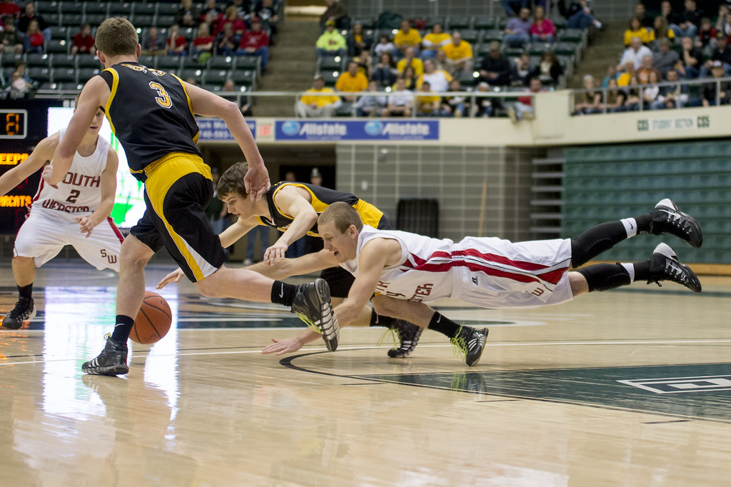 South Webster's Levi Cook and Paint Valley's Quinten Sparks get on the floor for a loose ball.