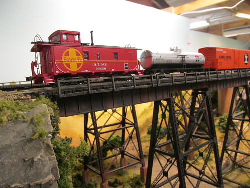 A 1970's era Atchison, Topeka & Santa Fe Railroad freight train crossing the tall steel trestle. by Eddie from Chicago