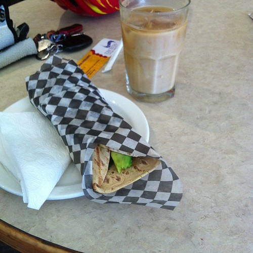 Turkey grilled sandwich and iced coffee at Gracious Goods. #yegfood by raise my voice