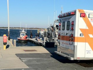 Crewmembers from Coast Guard Station Barnegat Light, N.J., medevac a head injury victim, Friday, Oct. 25, 2013. The 47-year-old man was a passenger aboard a 21-foot center console boat that ran aground in Oyster Creek, in the Barnegat Bay. U.S. Coast Guard photo 