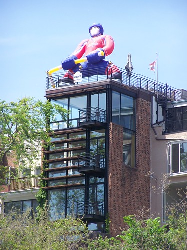 A Washington Capitals Hockey Team balloon person on top of a residence in Georgetown