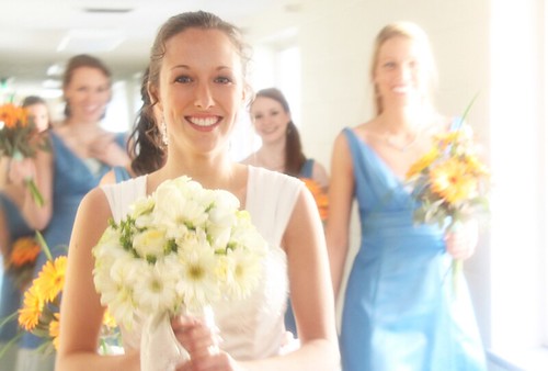 Bride smiling at wedding with bridemaids