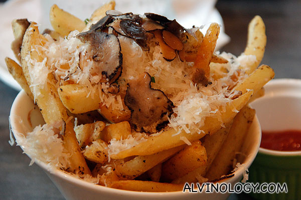 TRUFFLE FRIES (Thick cut French fries seasoned with white  truffle oil and topped with shaved truffles) - S$6.90