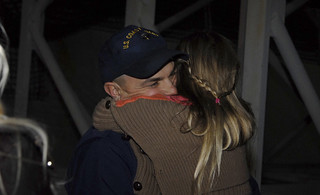 Petty Officer 1st Class John Savasta, assigned to Coast Guard Cutter Waesche, hugs his daughter at Coast Guard Island in Alameda, Calif., Friday, November 29, 2013. The Waesche's crew returned from a 109-day deployment in Gulf of Alaska, Bering Sea and Artic Ocean to its homeport at Coast Guard Island to reunite with loved ones for the holidays. U.S. Coast Guard photo by Petty Officer 3rd Class Loumania Stewart
