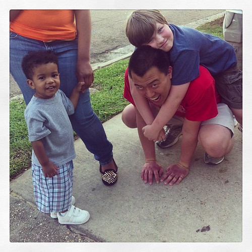 This little guy is Ike.  He was was the little girl in the other picture.  Travis was enjoying the prayer walk with the Belmont team as you can see. #prayerwalk #lifeatwewillgo #volunteer #missionarykid #neighbors #midtownjackson