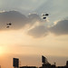 Army choppers circling Tahrir square carrying big flags
