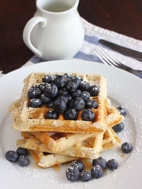 Fluffy and crisp vegan waffles that'll make your loved ones swoon as you pull this out for breakfast. #vegan #healthy #breakfast #blueberries
