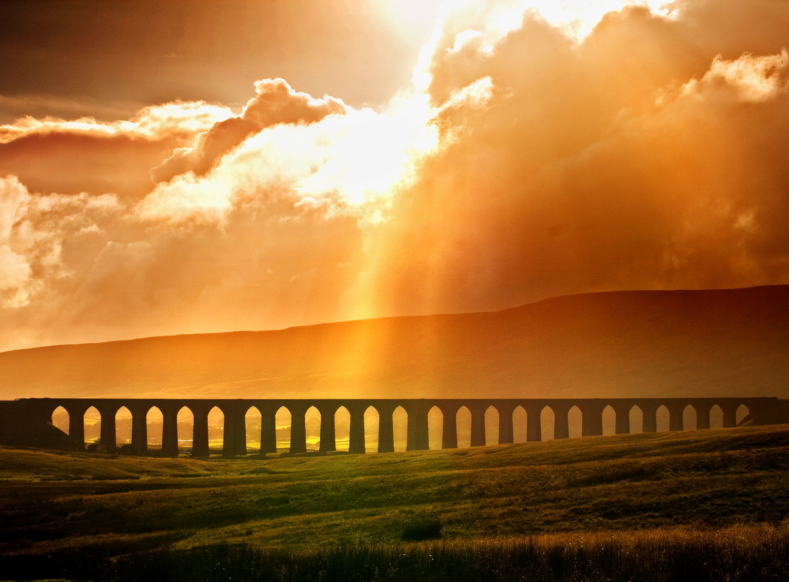 Ribblehead Viaduct cast in a glowing light. Credit chantrybee