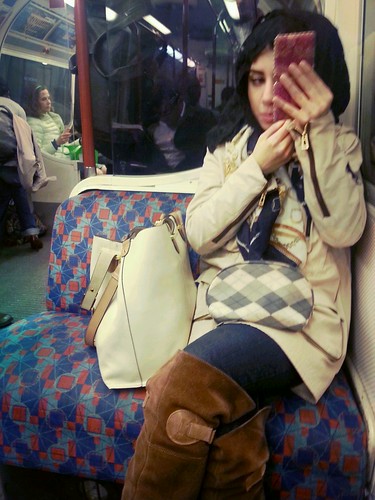 Applying make-up in the London Underground