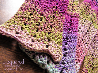 Chevron Scarf - a scarf worked in a zig-zag pattern with yarn that gradually fades from dusty rose, light blue, violet, magenta and moss green.