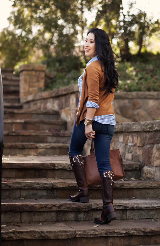 cute & little blog | equestrian chic | tan cardigan, blue gingham shirt, skinny jeans, ariat hacienda equestrian over-the-knee boots, statement necklace outfit