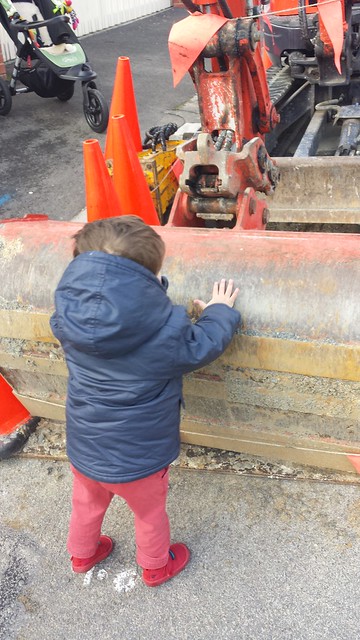 He got up the courage to touch the digger!