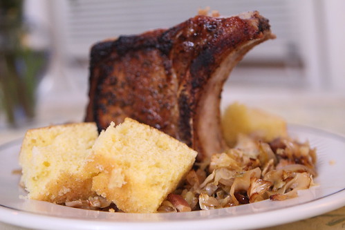 Pan-Seared Pork Chop with Smothered Andouille cabbage and Cornbread