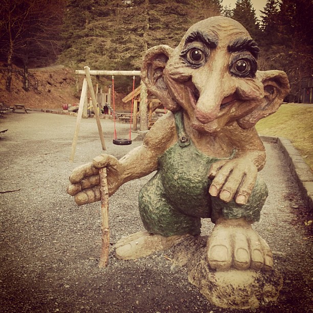 A troll(?) welcoming kids to a nightmarish (to me) playground on a mountaintop